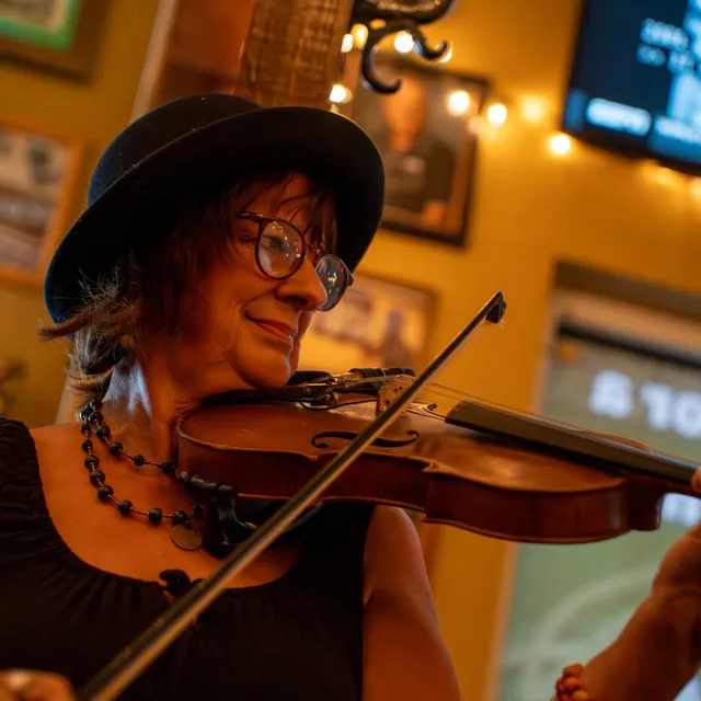 Kricket Moros playing fiddle