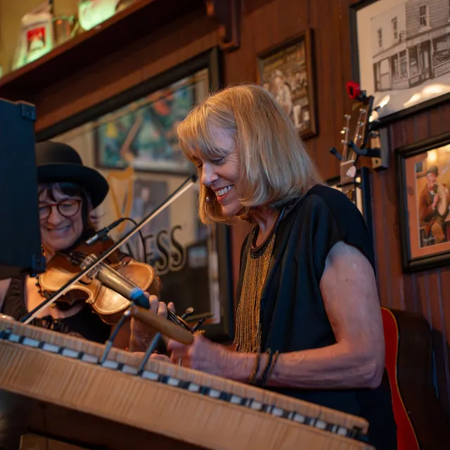 Robyn Rogers playing hammer dulcimer